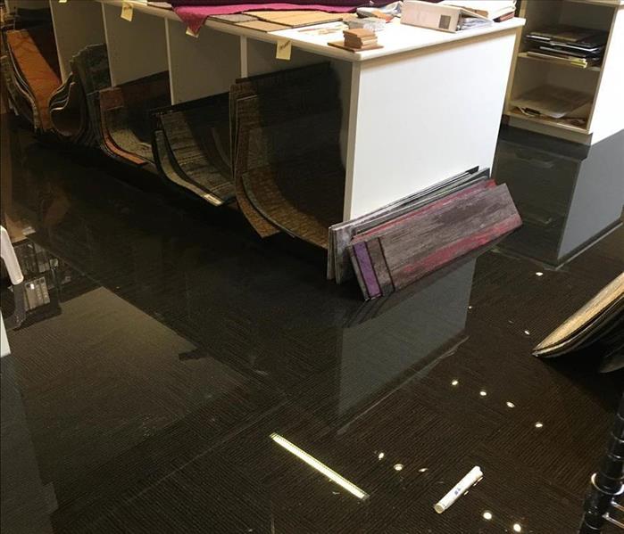 Water standing in office space. 