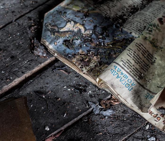 burnt newspaper covered in soot.