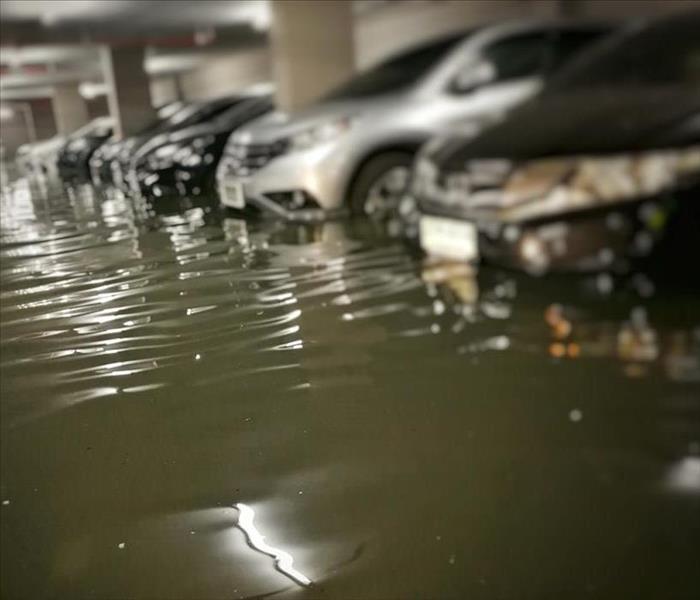flooding car in basement carpark at condominium.